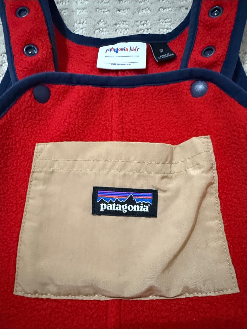 Patagonia Red Fleece Overalls with Navy Trim and Tan Chest Patch - Picture 2 of 4